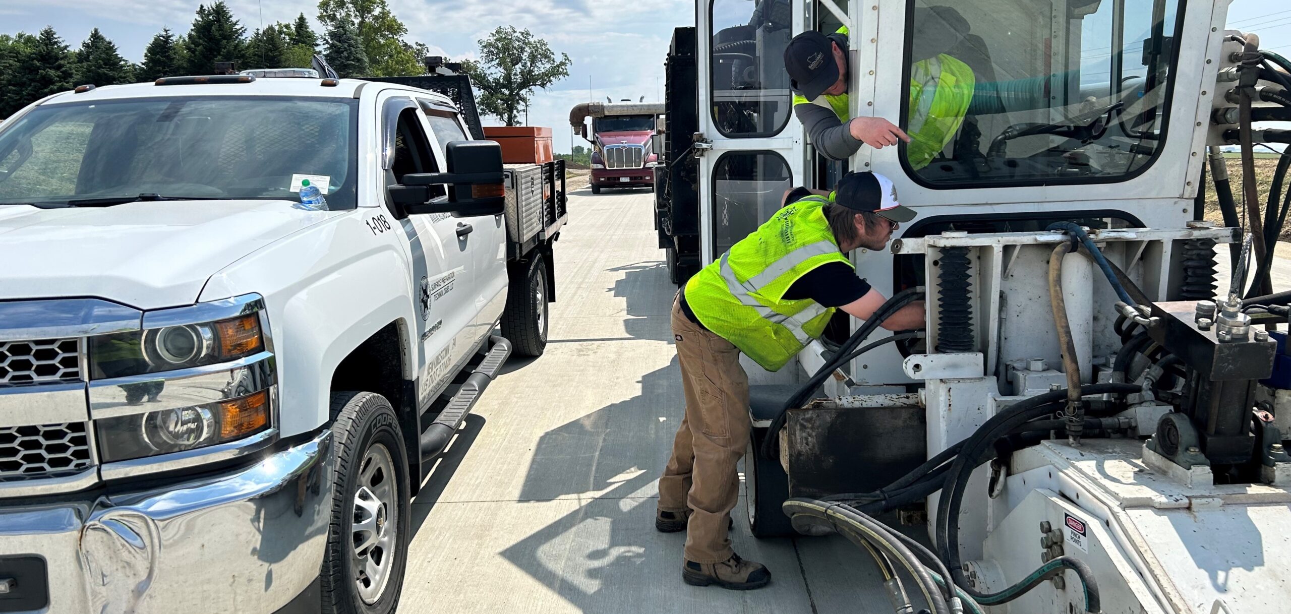 road-crew-checking-equipment